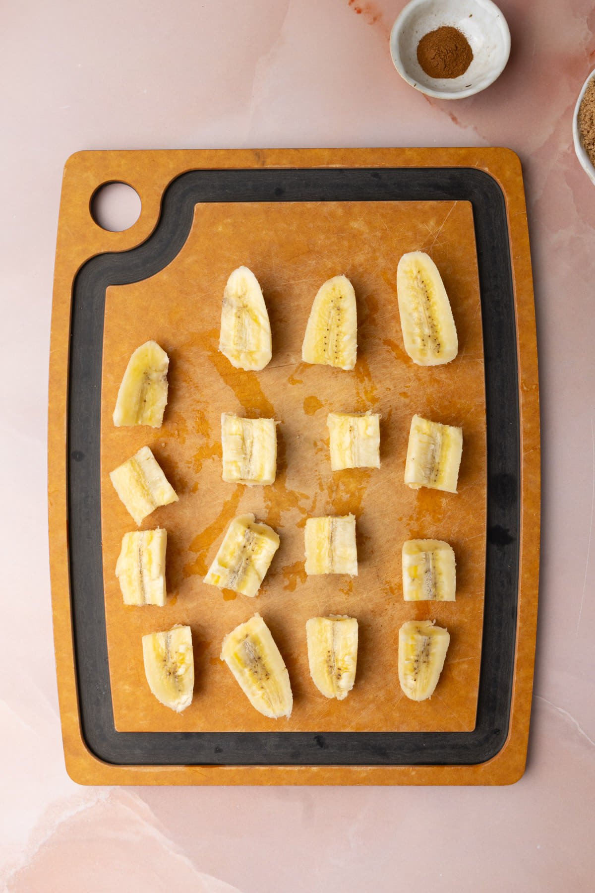 Ripe banana sliced in half lengthwise and then into 4 pieces. 