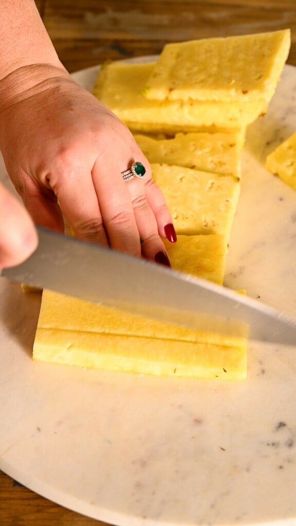 Cutting pineapple into thin slices