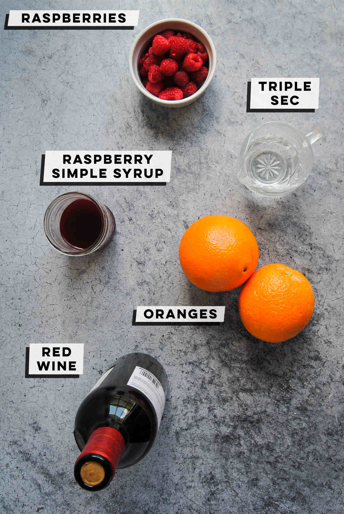 fresh raspberries, triple sec, raspberry simple syrup, 2 oranges, and a bottle of red wine