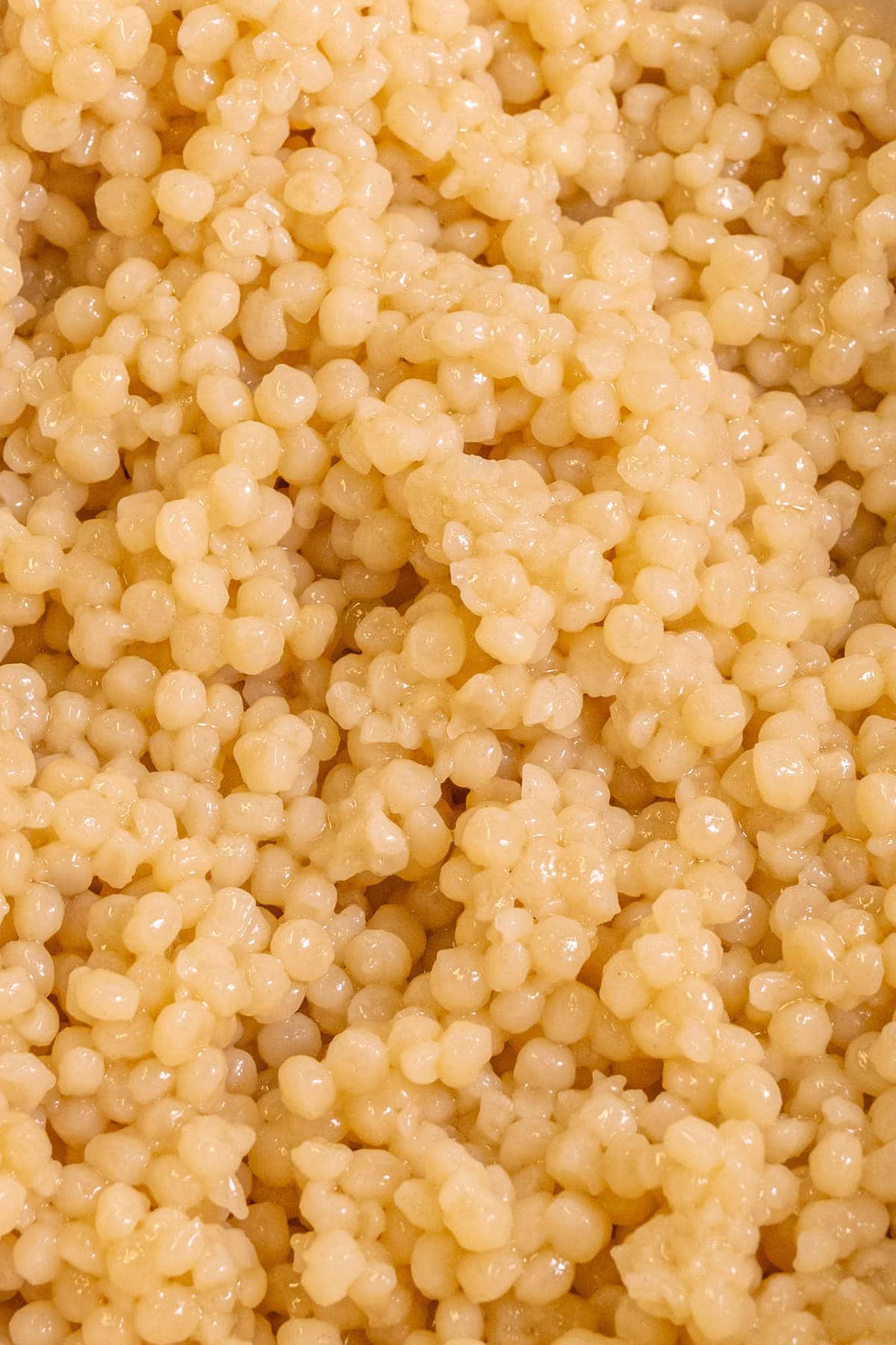Close up of couscous dressed with lemon and olive oil 