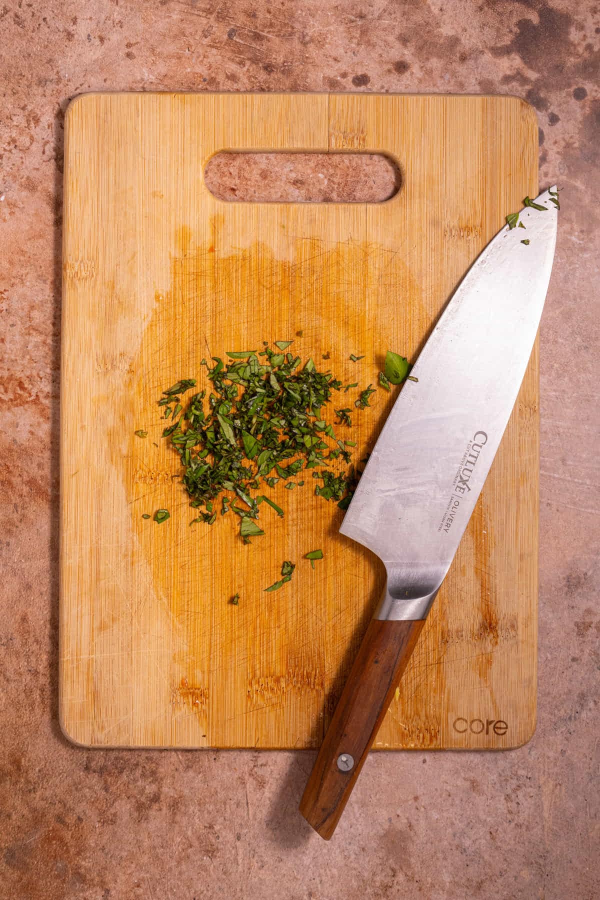 Diced fresh basil leaves on a chopping board