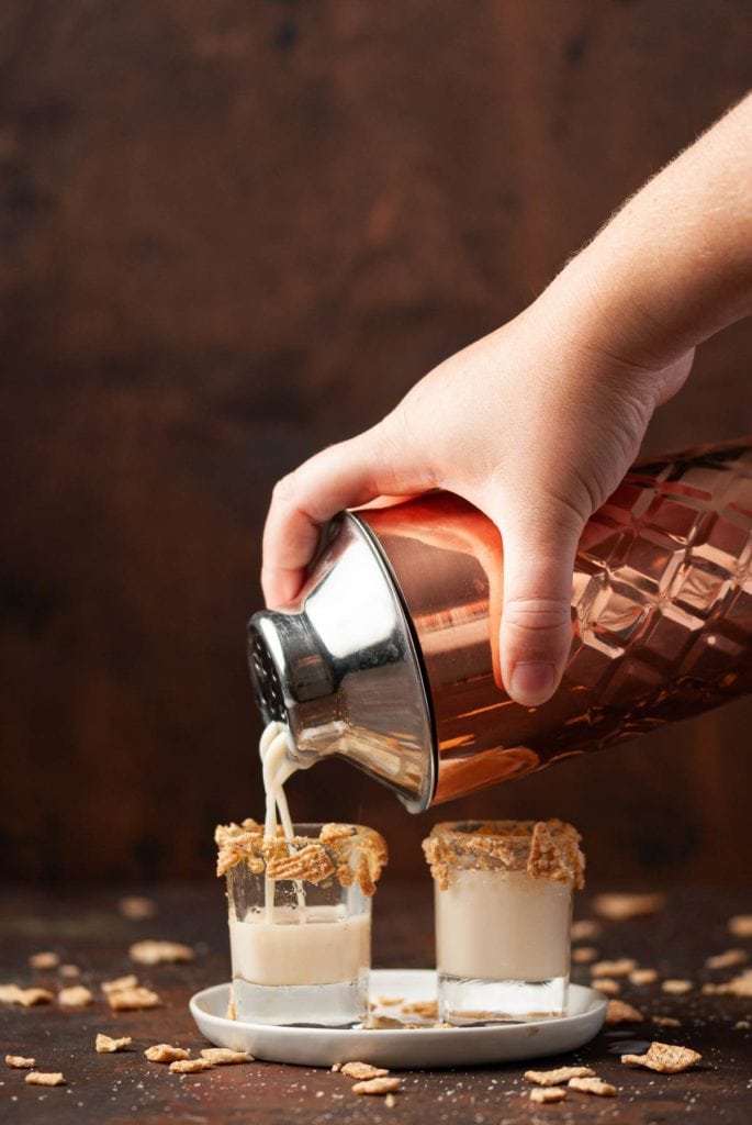 pouring shot from cocktail shaker