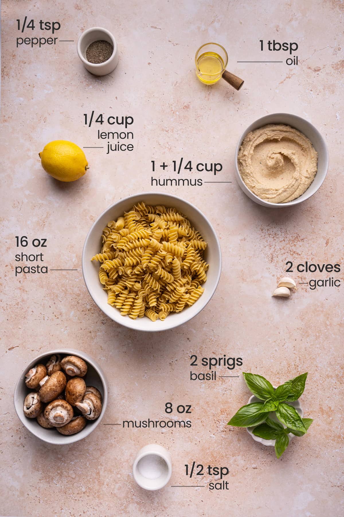 All ingredients for Hummus Pasta - hummus, lemon, basil, pasta, black pepper, salt, garlic, mushrooms