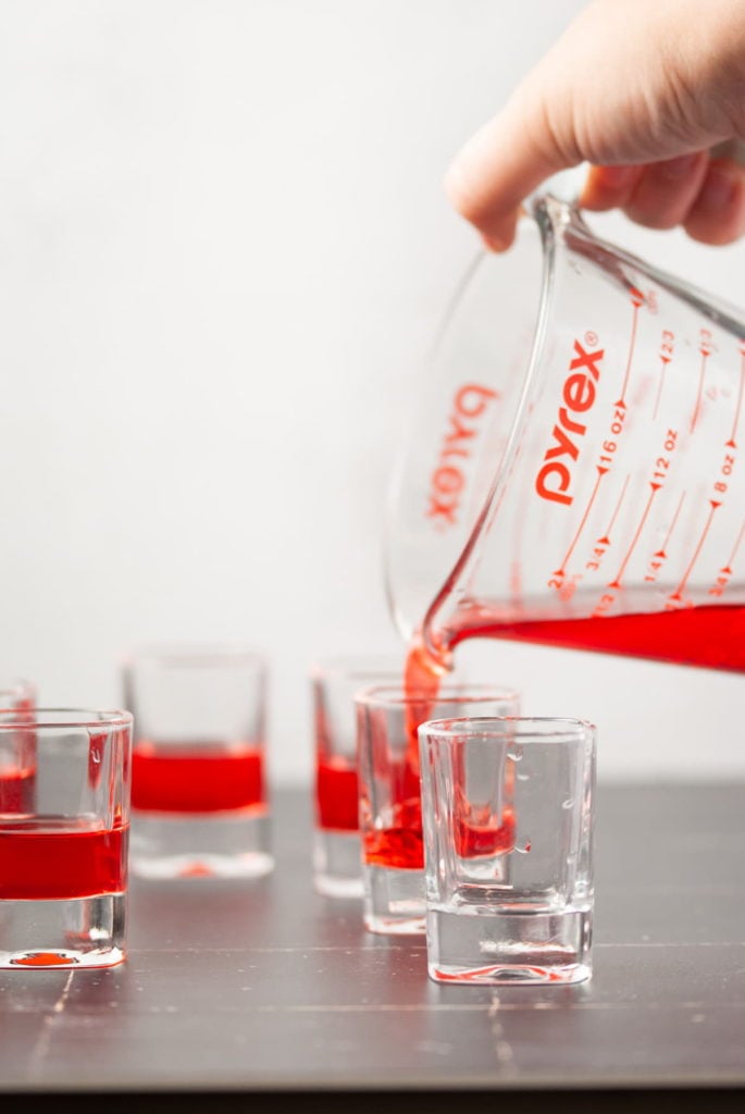 Pouring Red Jello into Shot Glass