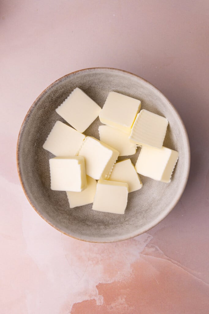 Butter cubed in a bowl to melt in the microwave more readily. 
