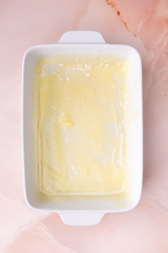 Casserole dish greased with melted butter. 