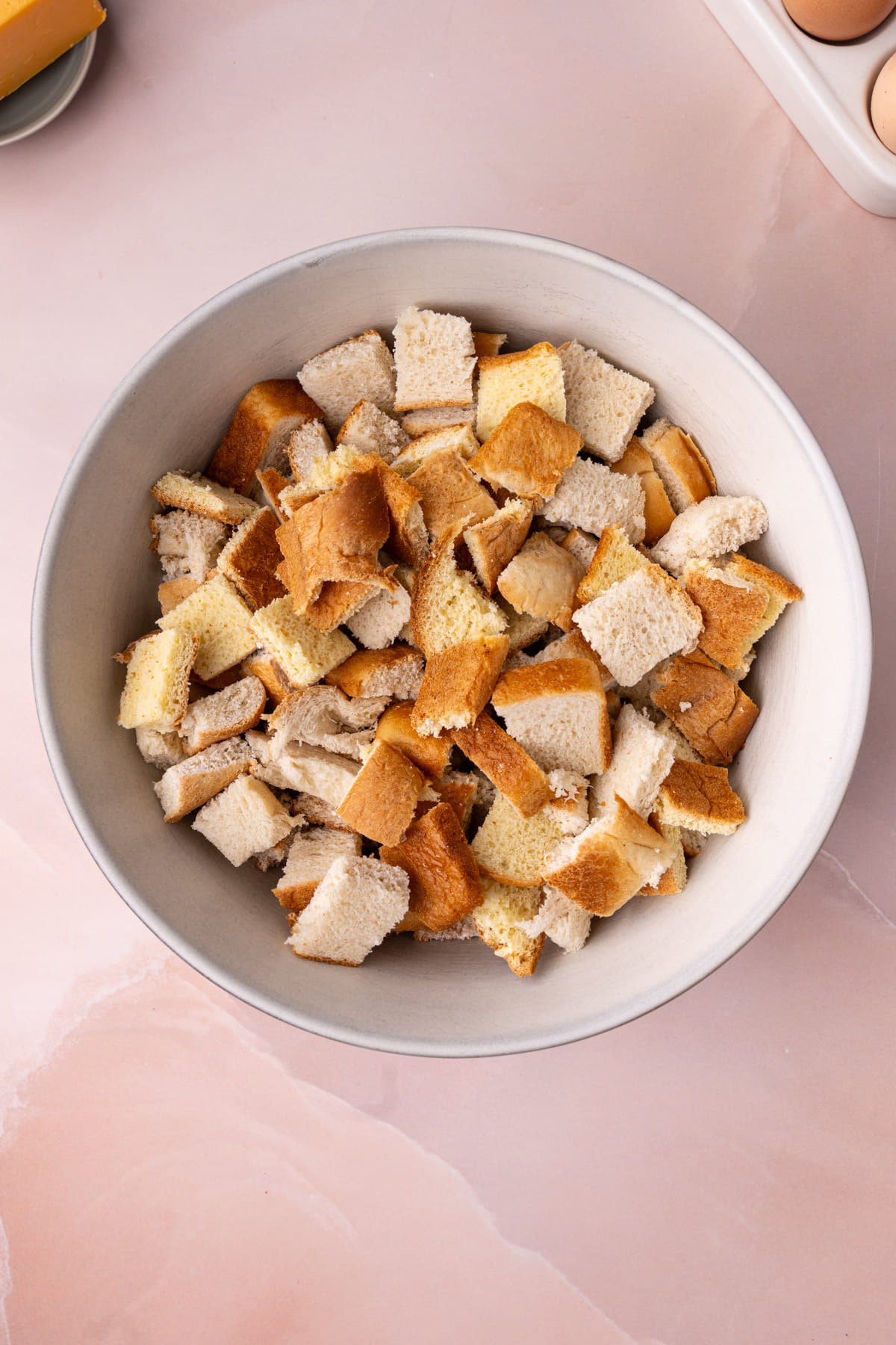 Cubed bread in a large bowl. 