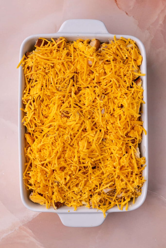 Savory French toast casserole with a generous layer of cheddar cheese on top. 