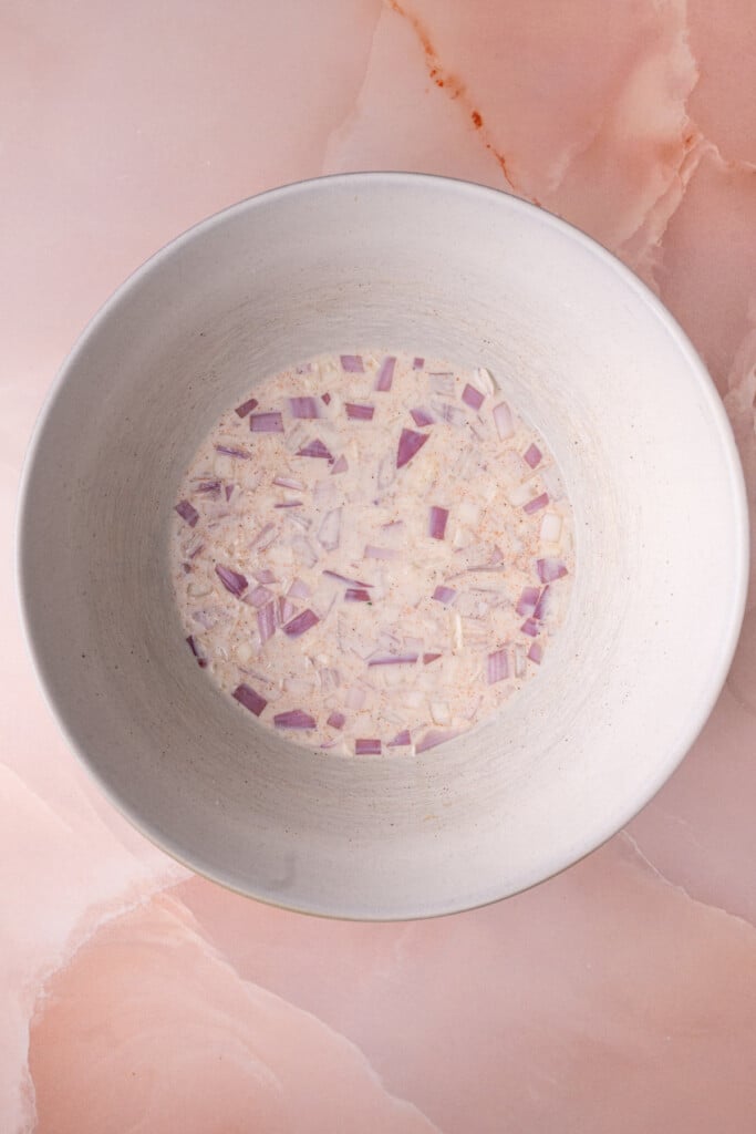 Milk, diced shallot, salt, pepper, and paprika whisked together.