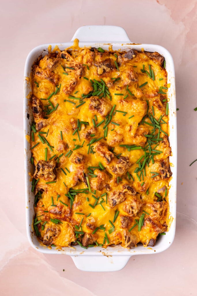 Savory French Toast Casserole garnished with fresh diced chives. 