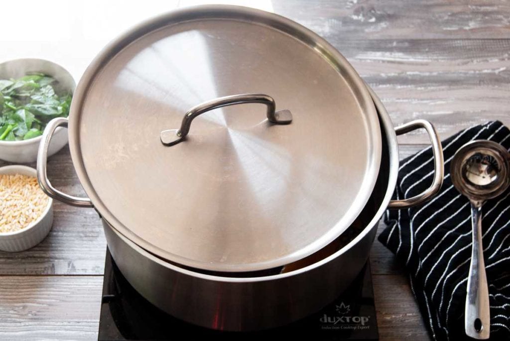 Pot with Lid on off-center to allow steam out