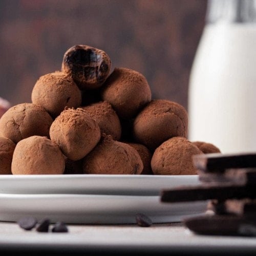 stack of chocolate whiskey truffles on two plates