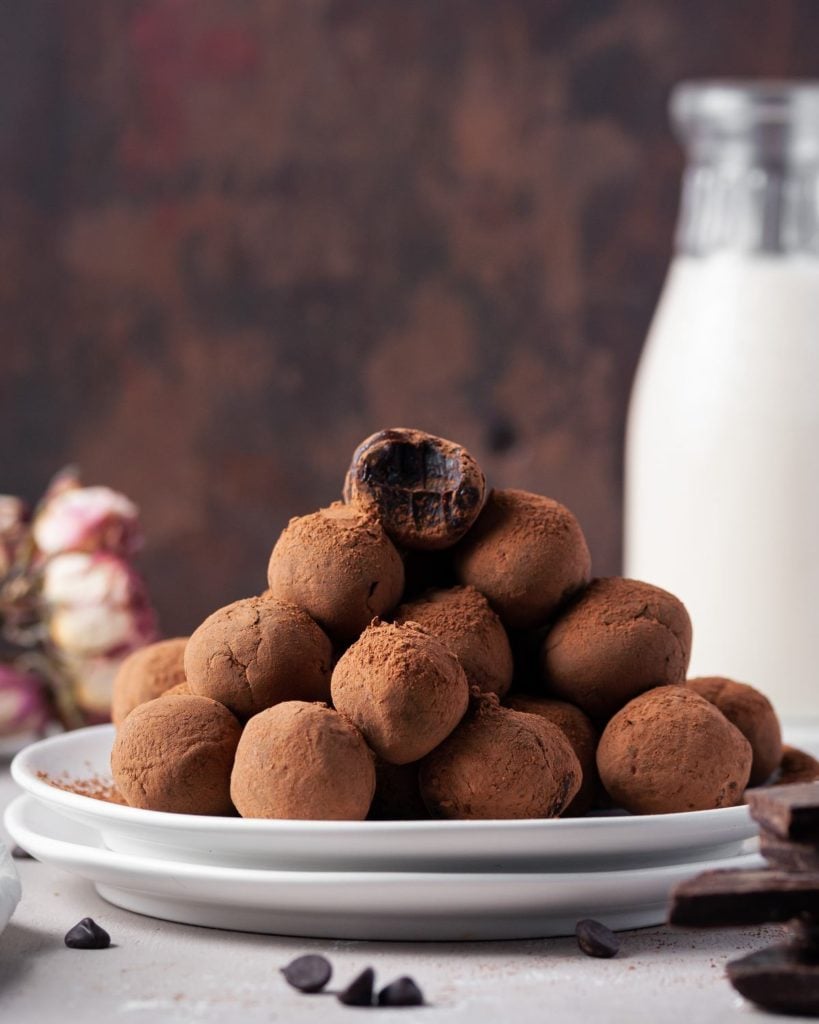 tower of chocolate truffles with one at the top with a bite taken out