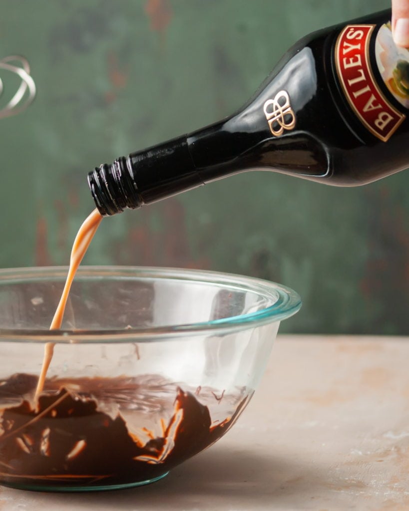 Adding Bailey's Irish Cream to hot chocolate mixture