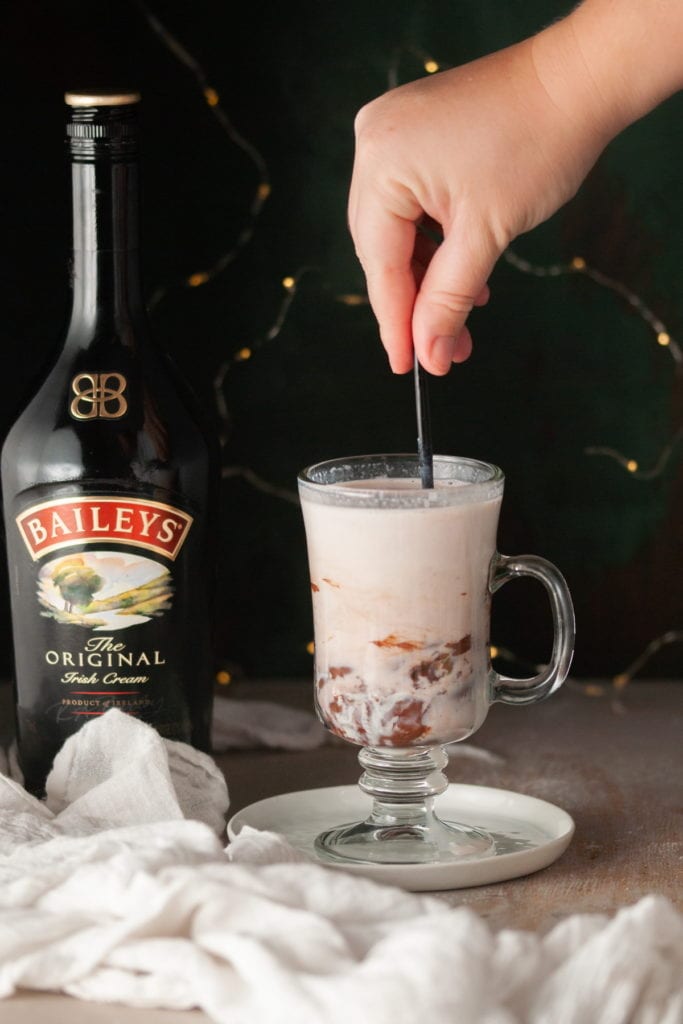 Stirring Hot Milk with Baileys Hot Chocolate Bombs