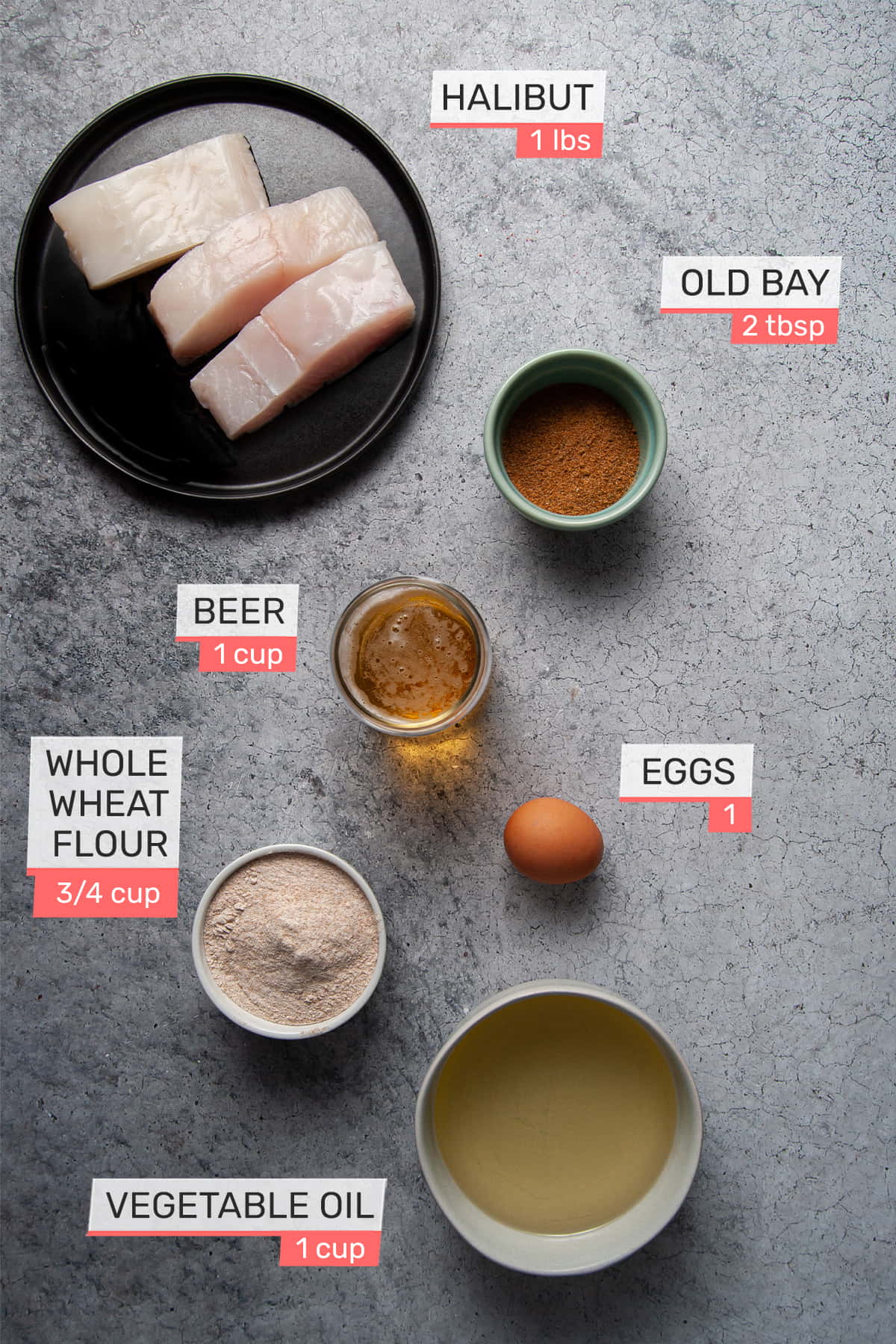 overhead view of all ingredients for beer battered halibut - halibut, old bay seasoning, beer, egg, flour, vegetable oil