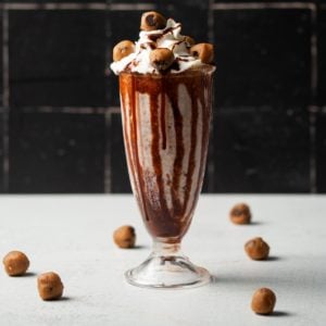 cookie dough milkshake - surrounded by little balls of edible cookie dough