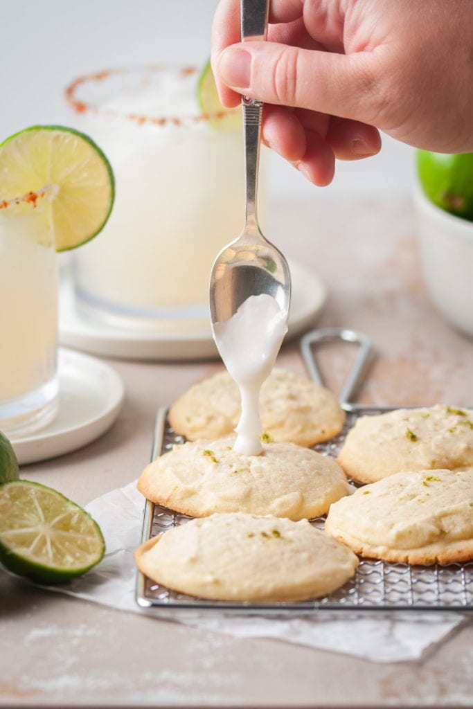 adding tequila lime glaze to margarita cookies