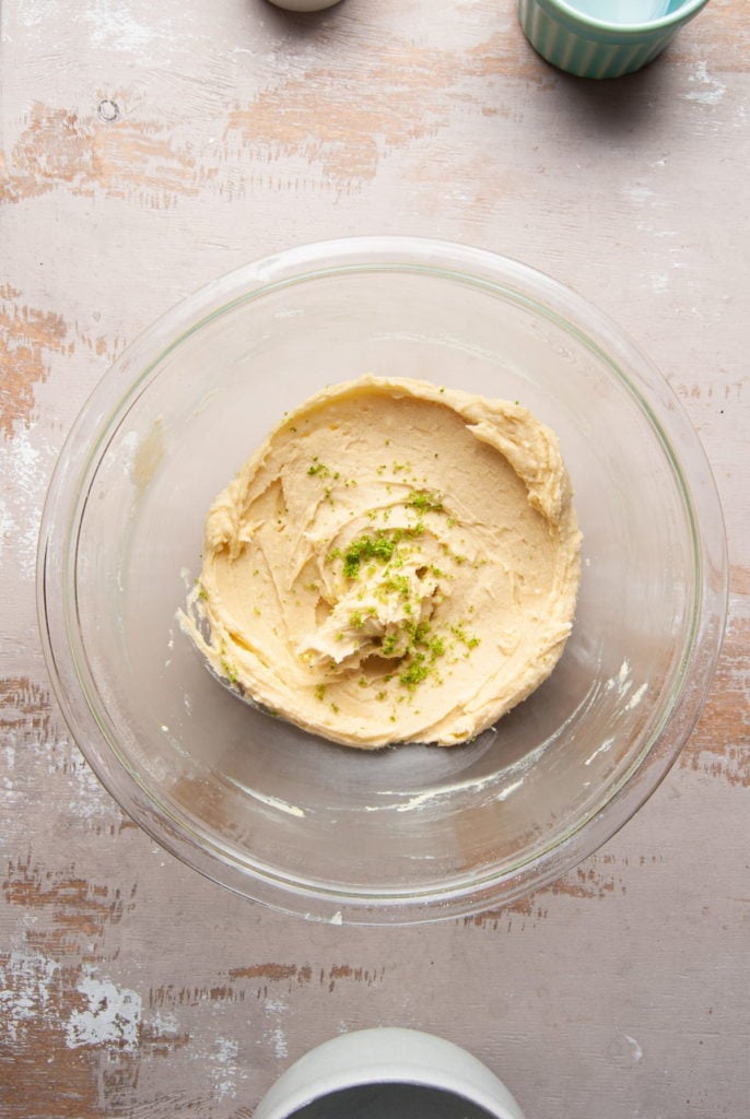 adding lime juice and zest to shortbread cookie batter