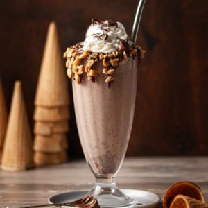 Nutella Milkshakes with ice cream cones stacked in the background