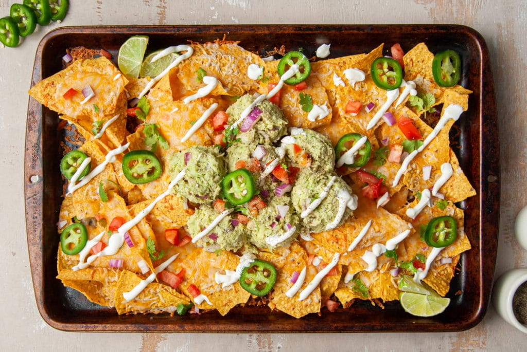 Sheet Pan Nachos with tuna, avocado, and lime