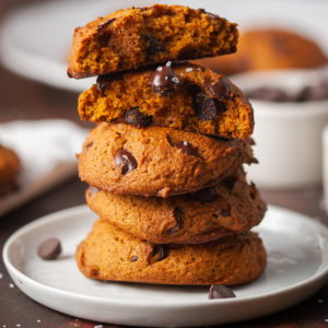 Stack of Vegan Pumpkin Chocolate Chip Cookies on a tiny plate