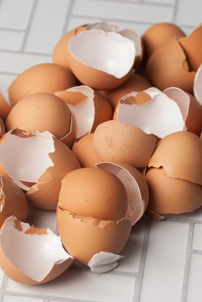 pile of egg shells on the counter top