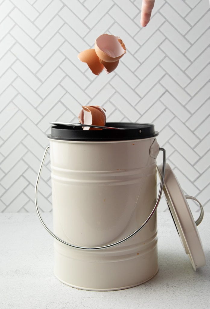 throwing egg shells into compost bin