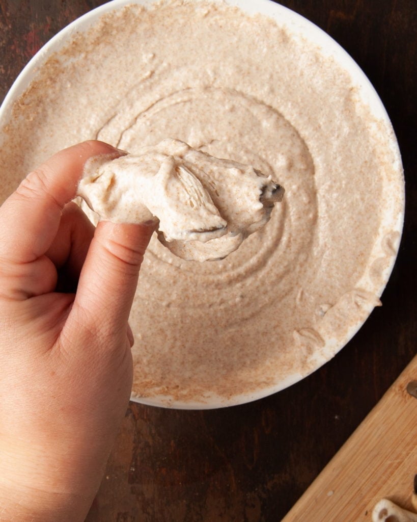 dipping oyster mushrooms in batter