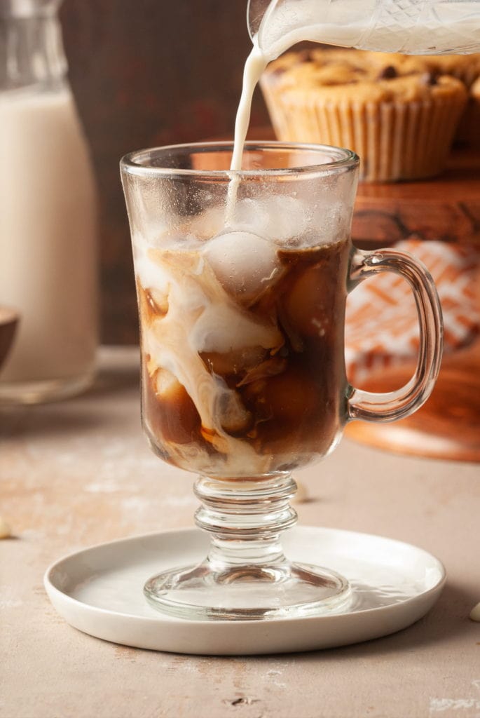 milk swirling into espresso