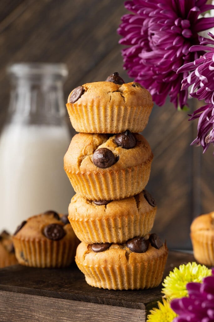 Close up of four Peanut Butter Banana Chocolate Chip Muffins stacked
