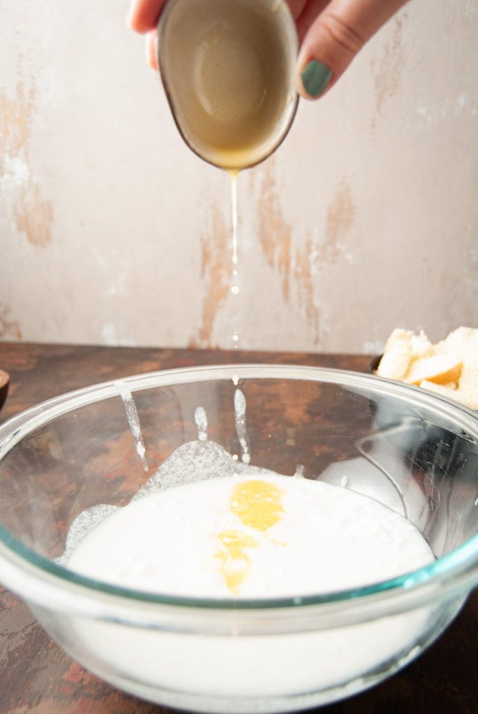 pouring melted butter into a large mixing bowl