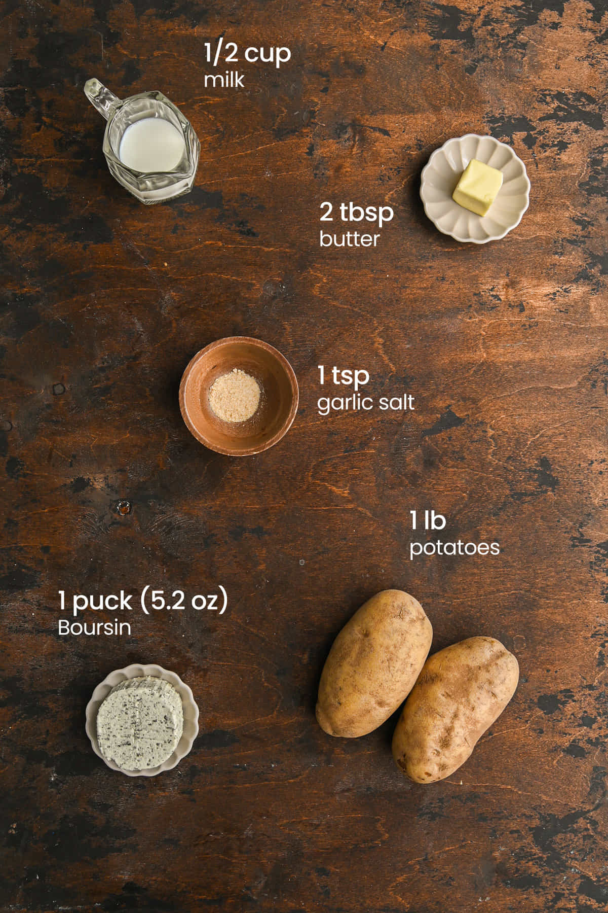 Everything you need to make Boursin Mashed Potatoes including potatoes, butter, Boursin cheese, garlic salt, milk, and butter.