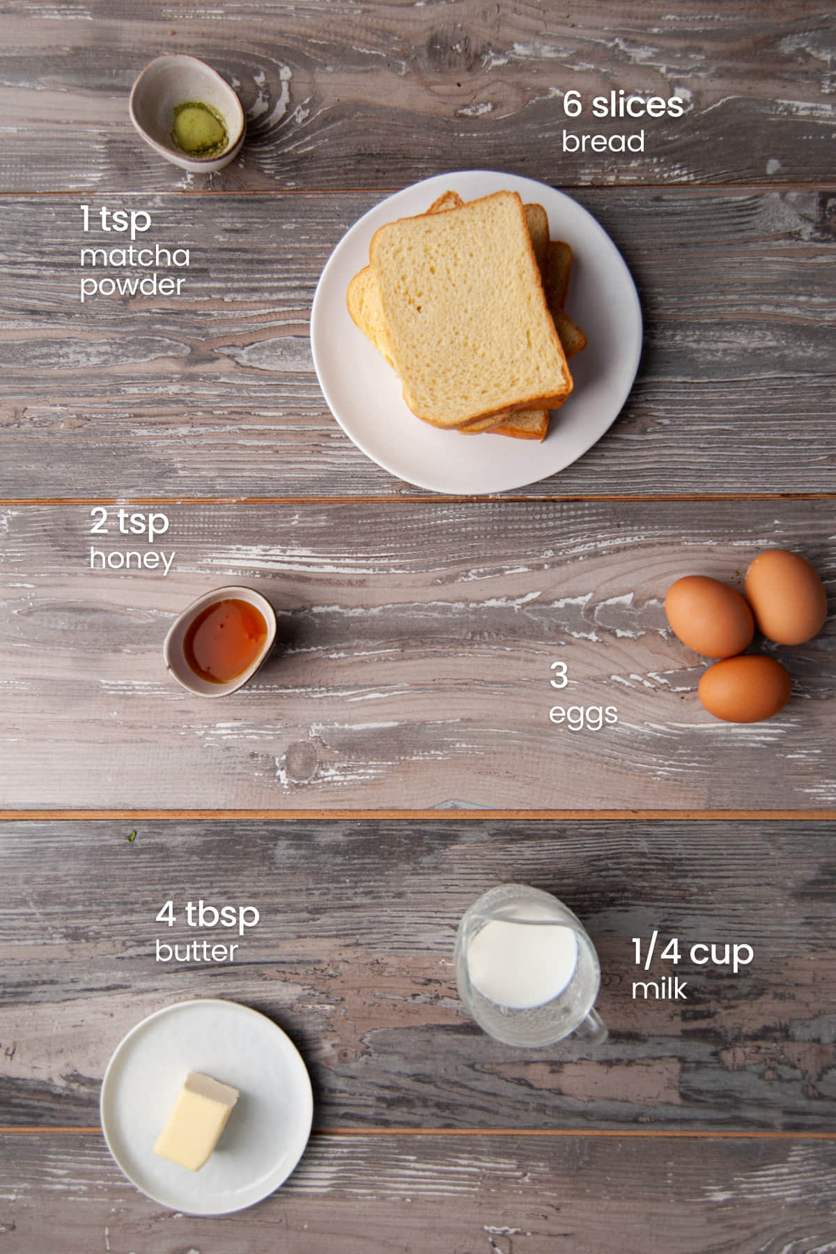 Everything you need to make Honey Matcha French Toast including day-old bread, matcha powder, honey, eggs, milk, and butter to fry it in.