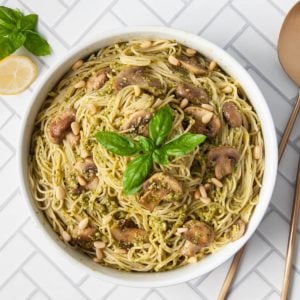 overhead shot of serving bowl filled with mushroom pesto pasta