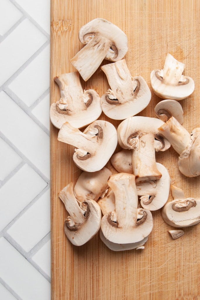 slicing mushrooms for mushroom pesto pasta