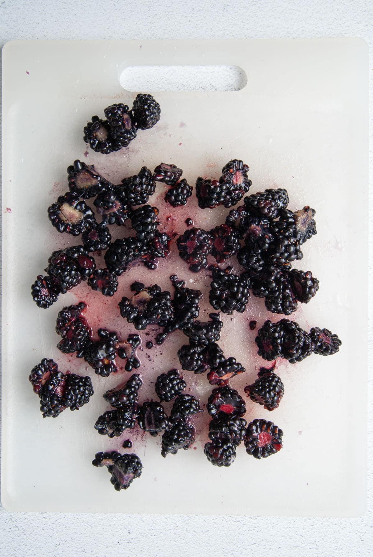 chopping blackberries to add to muffins