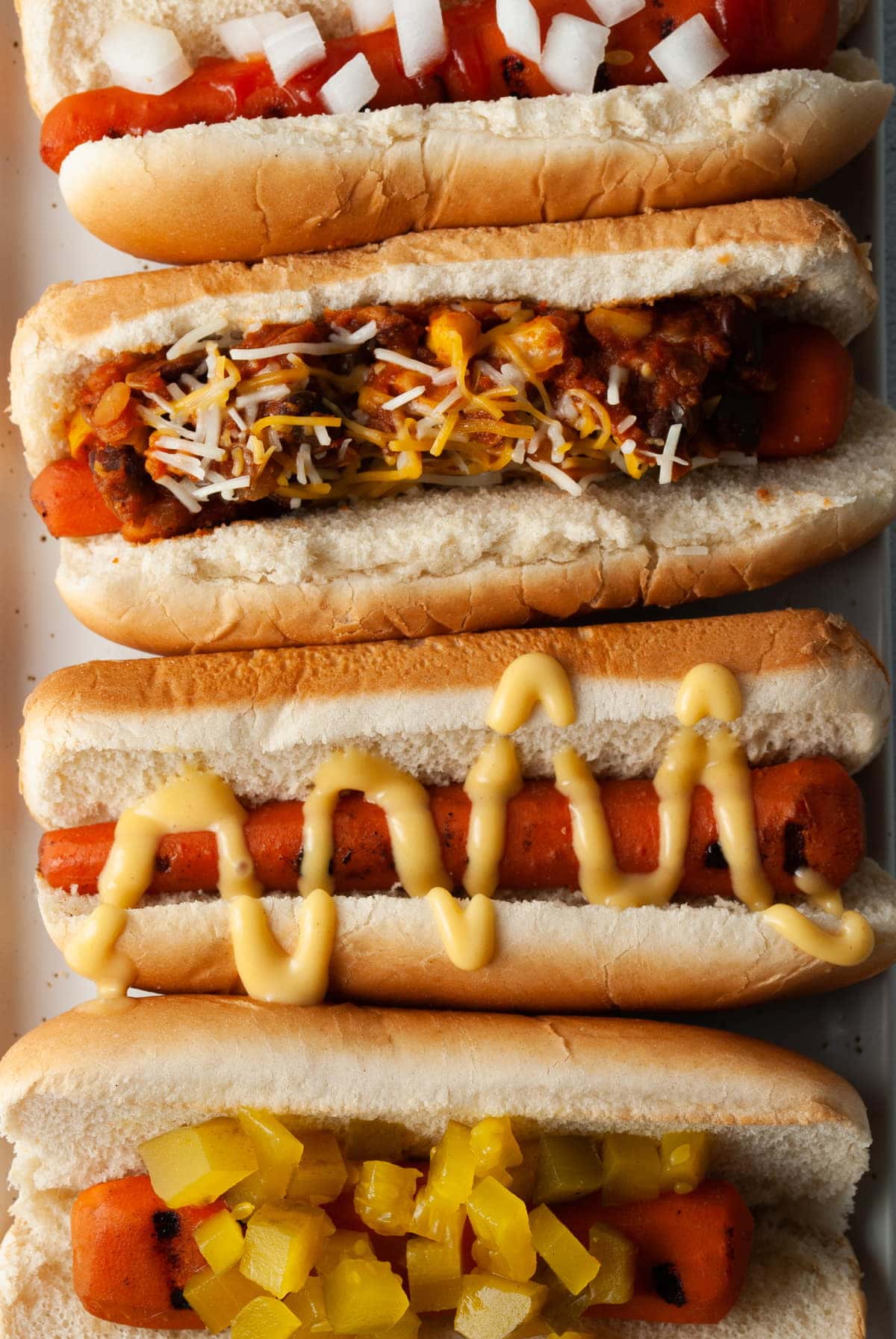 4 carrot dogs with 4 different toppings