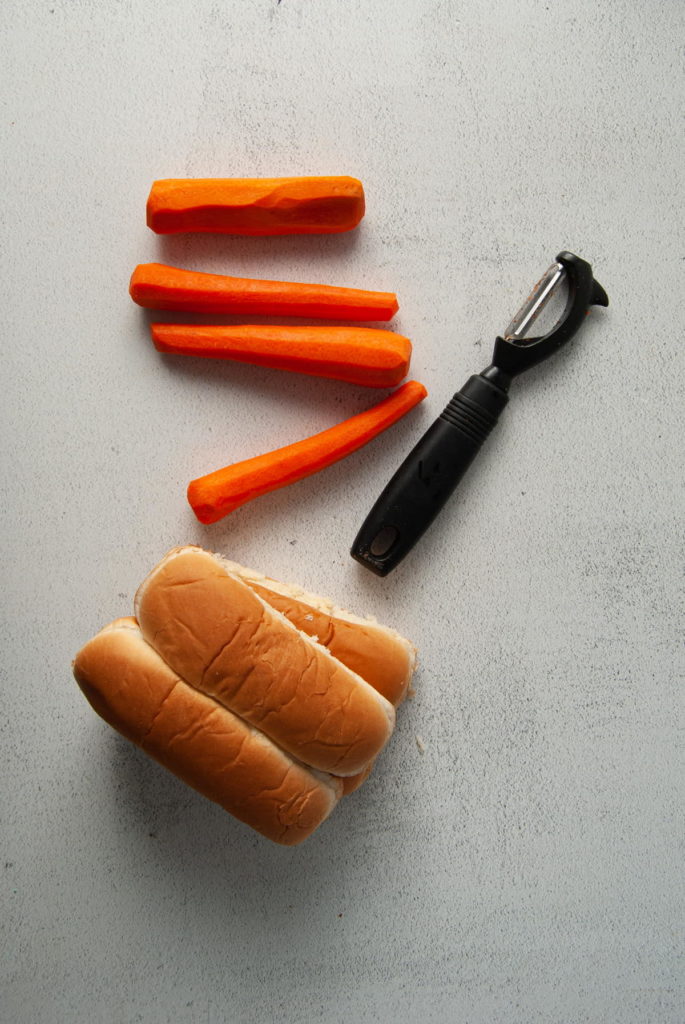 carrots peeled and cut to resemble hot dogs and hot dog buns