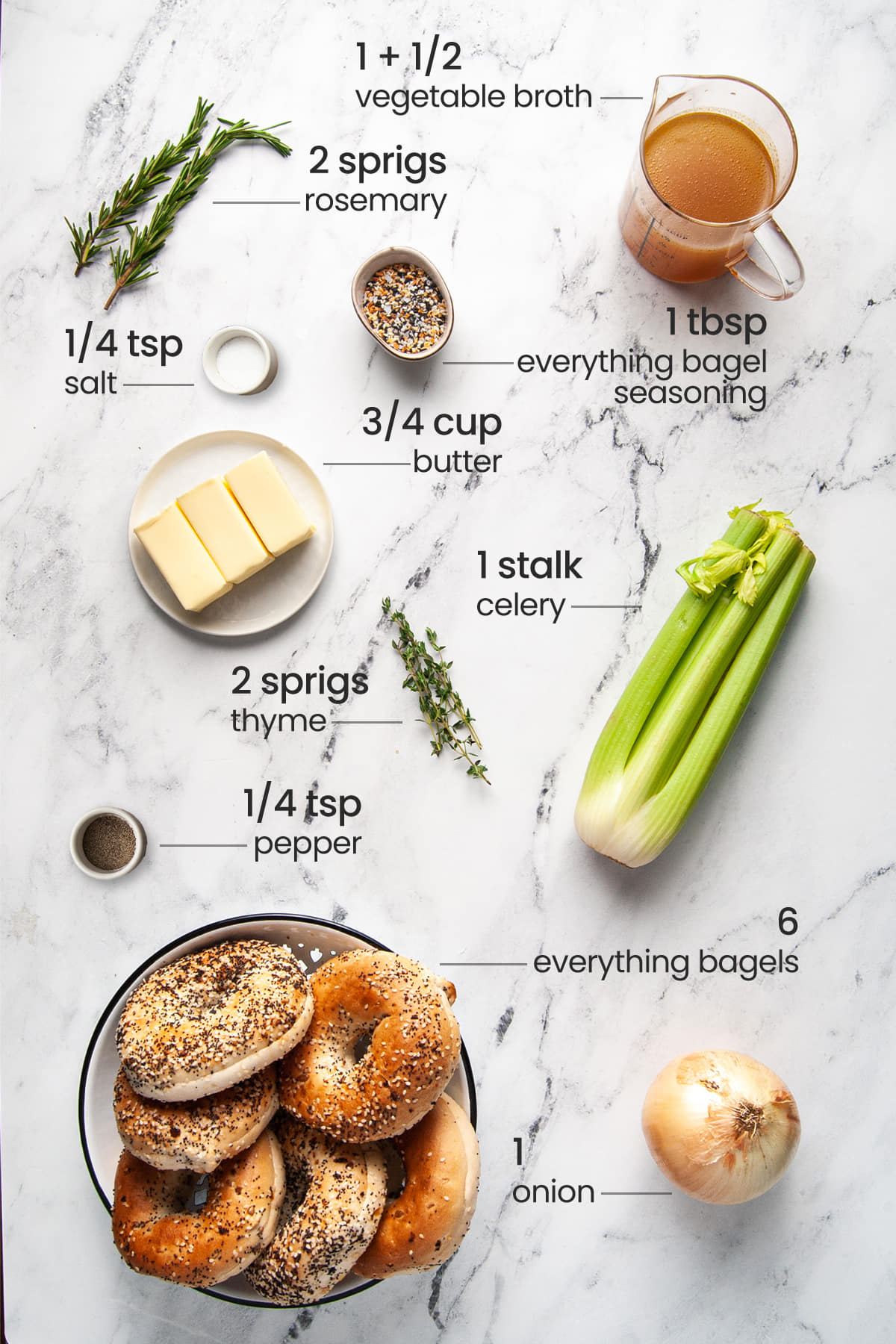 All ingredients for Everything Bagel Stuffing - Rosemary, everything seasoning, veggie broth, butter, thyme, celery, bagels, salt, pepper, and an onion