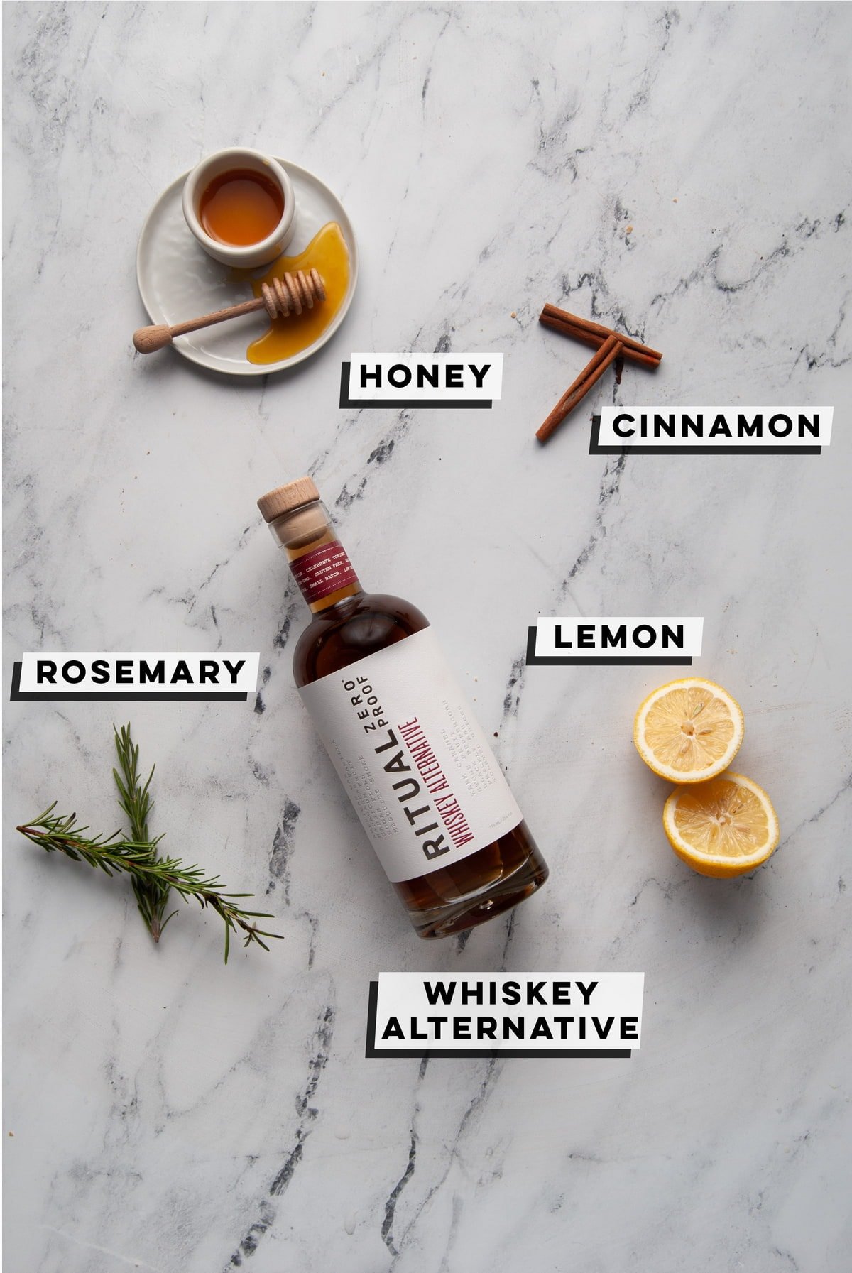 honey, cinnamon, rosemary, lemon, and Ritual Zero Proof Whiskey Alternative