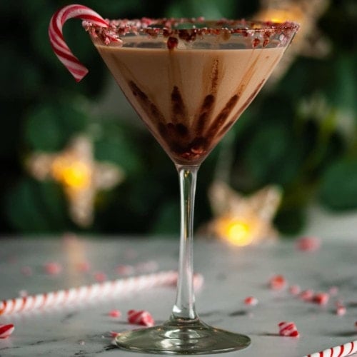 close up of martini glass with candy cane and chocolate martini