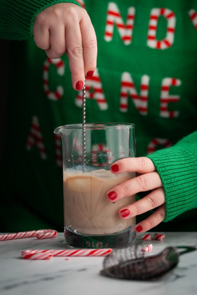 mixing a creamy chocolatey cocktail in a cocktail mixing glass