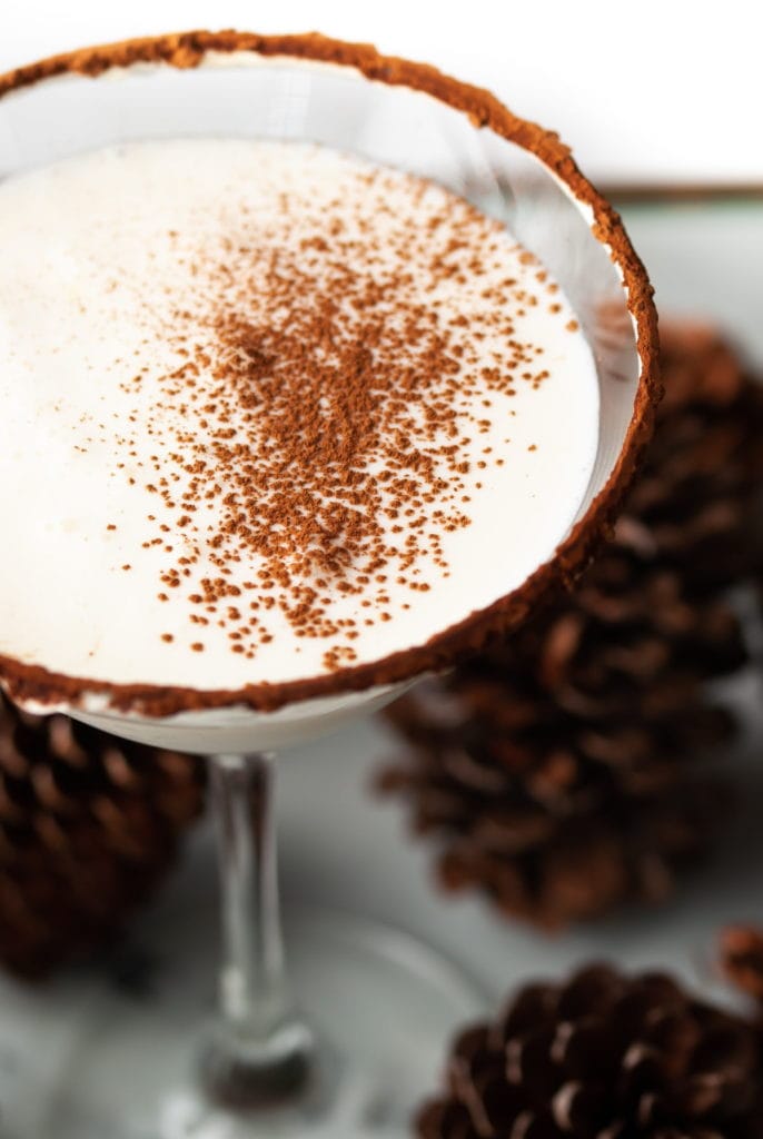 close up of white chocolate martini dusted with cocoa powder