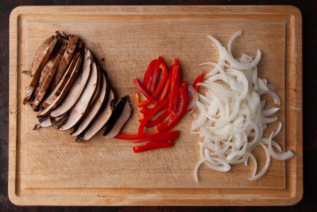 sliced portobello mushrooms, sliced red pepper, and sliced yellow onion