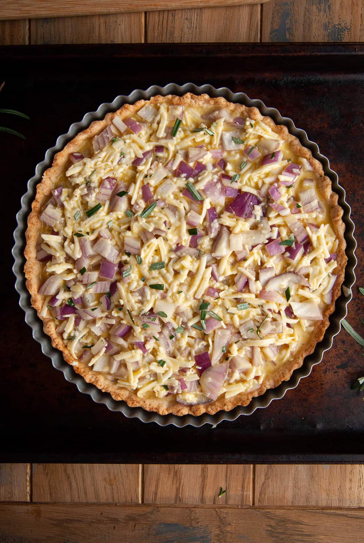 Apple and cheddar quiche before adding the apple topping.