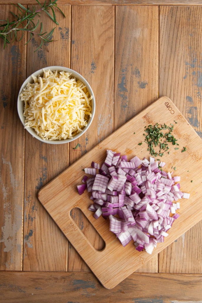 shredded cheese, diced onion, and chopped rosemary