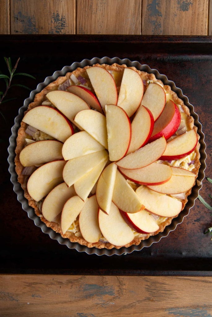 adding inner layer of apple slices on top of a quiche