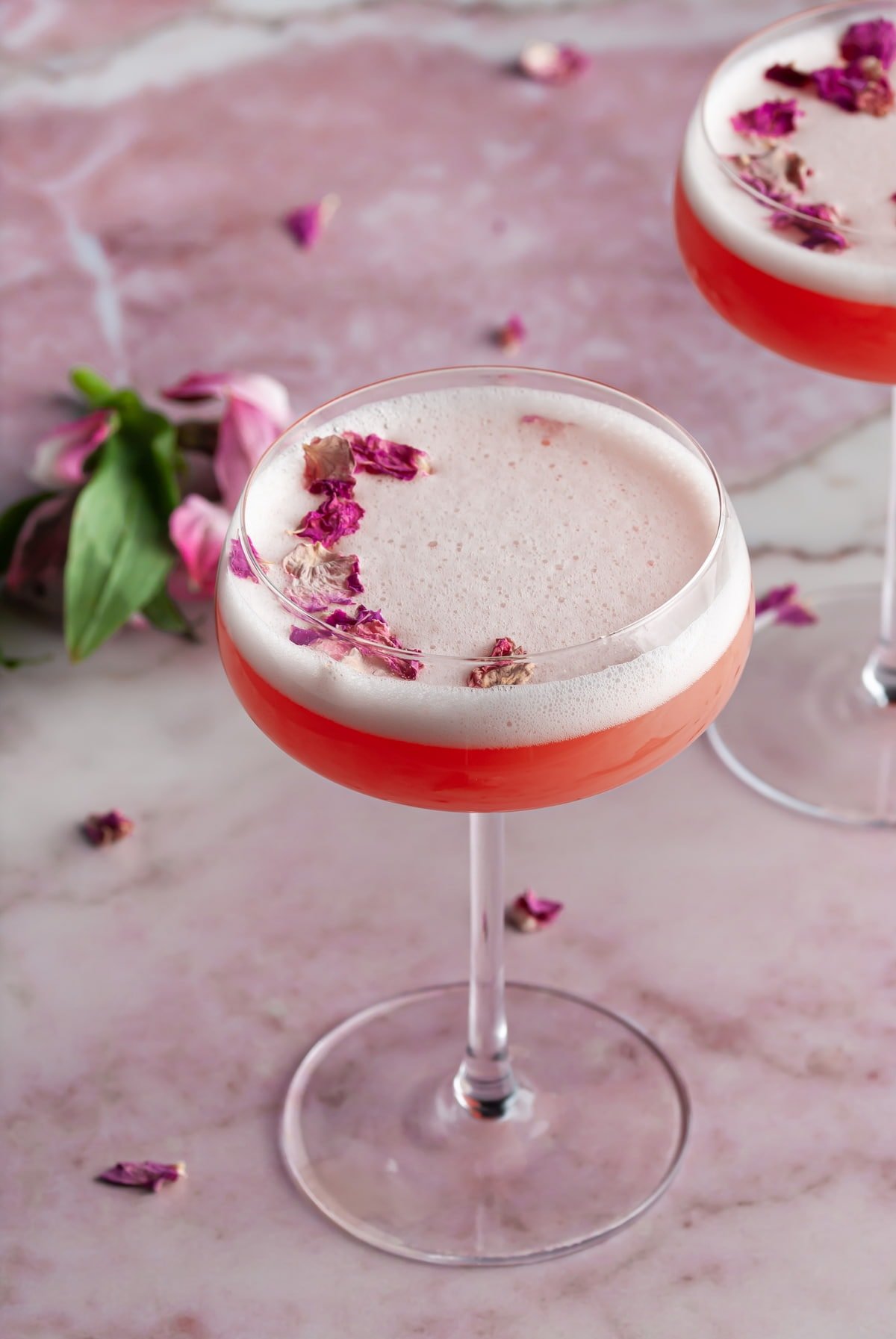 Valentines Day Cocktail with pink background and flowers