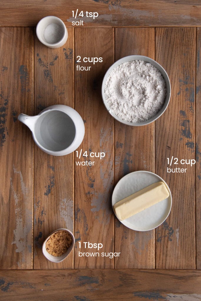 Everything you need to make the crust for apple cheese quiche including salt, flour, water, butter, and brown sugar.